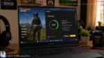How to Secure Your PC: Best Free Antivirus for Windows 11 in 2026 A modern gaming laptop setup in an Indian home showing an antivirus scan running alongside a game