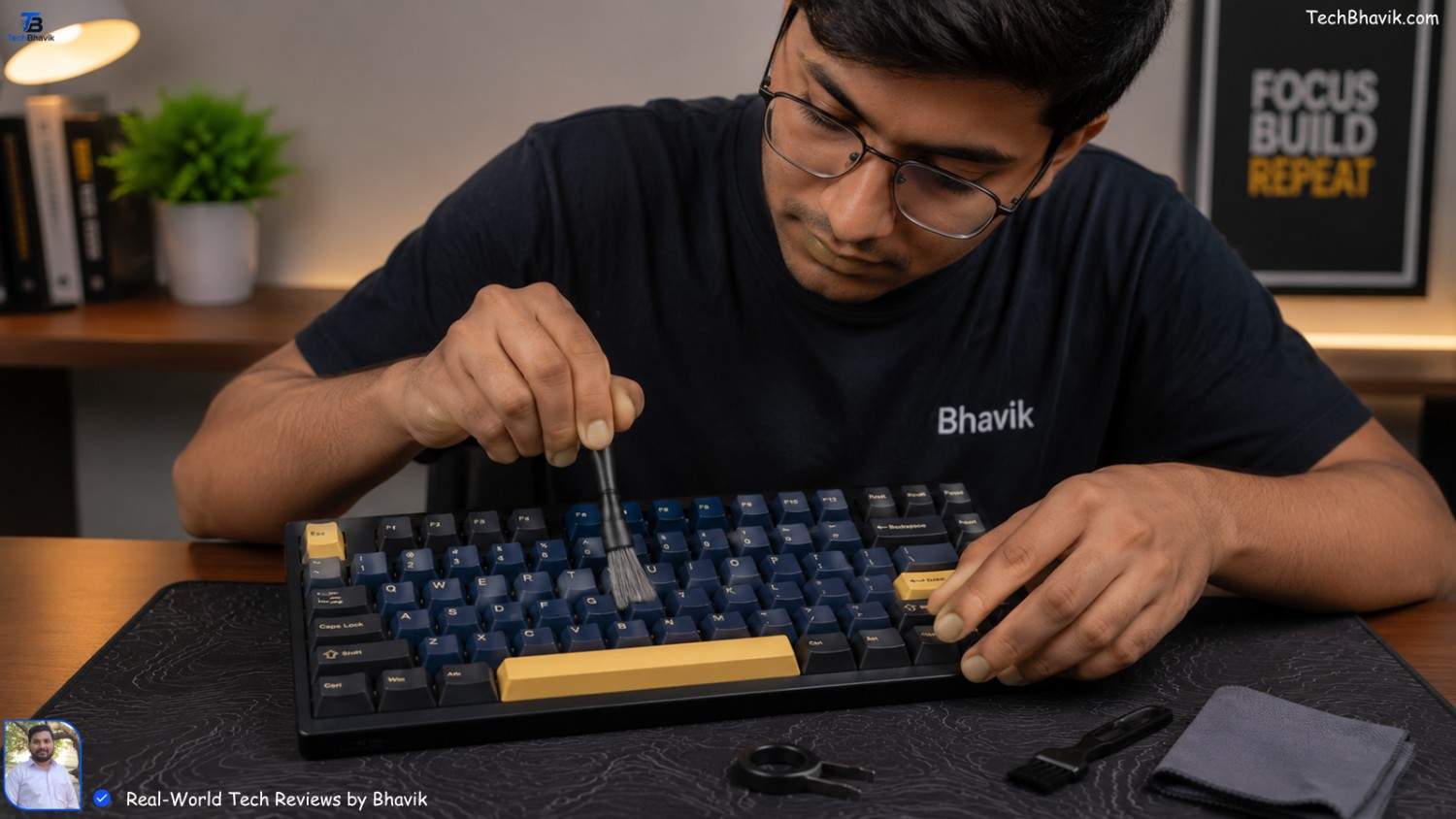 Best Wired Keyboard for Fast Typing in India (2026 Guide) Bhavik using a small brush to clean dust from between the keys of a mechanical keyboard