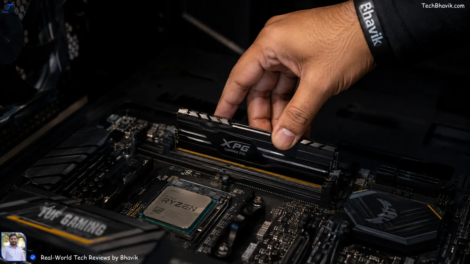 Bhavik’s hand installing a RAM stick into a motherboard with focused lighting