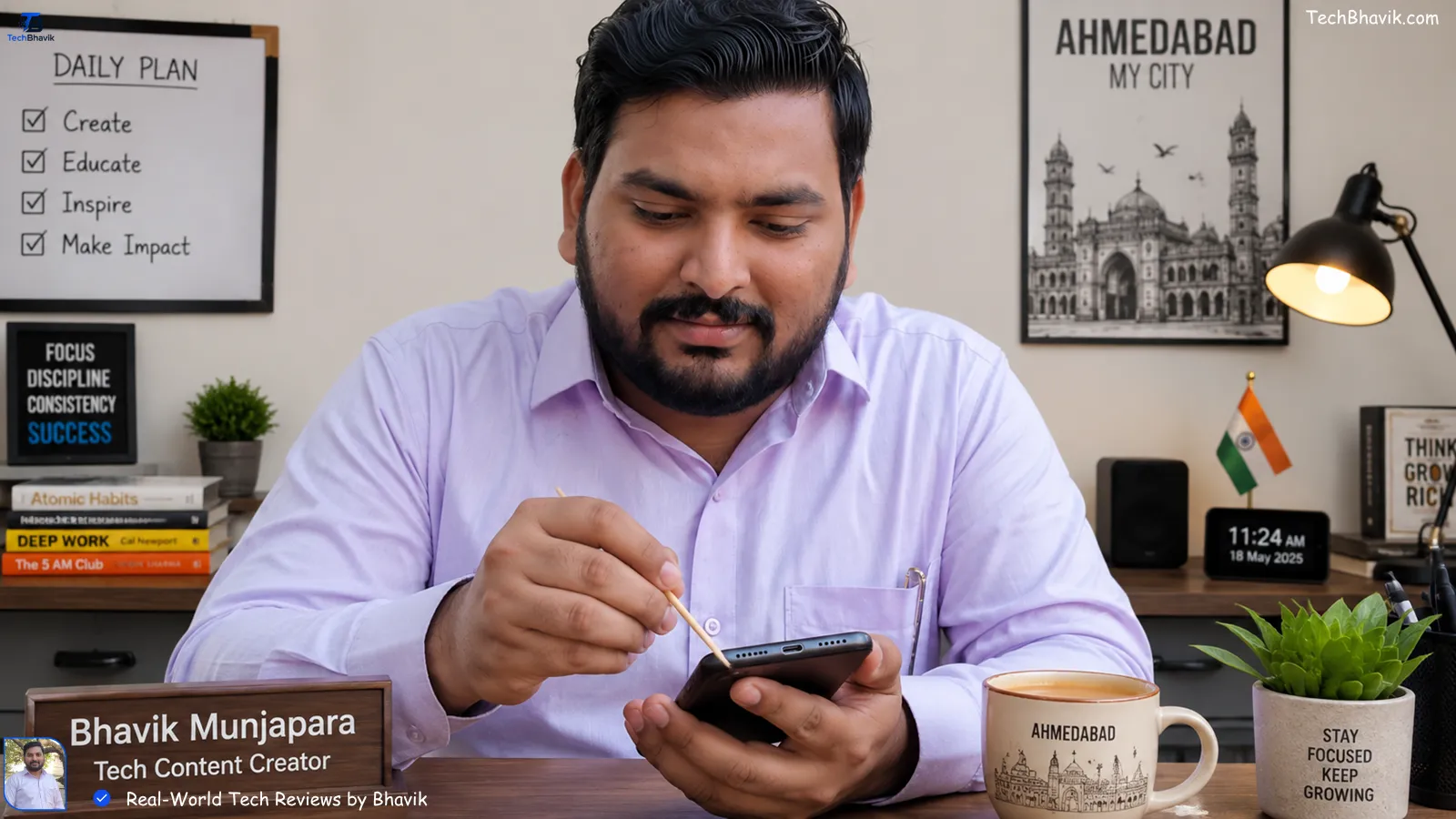 smartphone last 5 years Bhavik Munjapara using a wooden toothpick to clean dust from a smartphone charging port at his Ahmedabad desk with a cup of chai nearby
